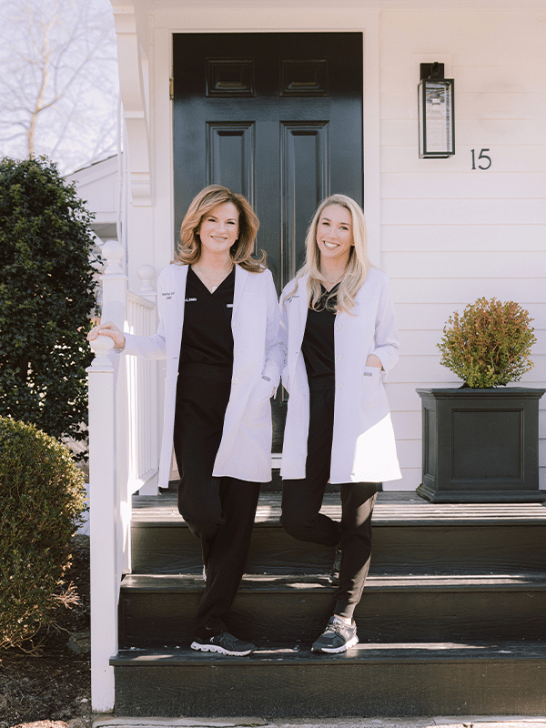 Both doctors on the black steps